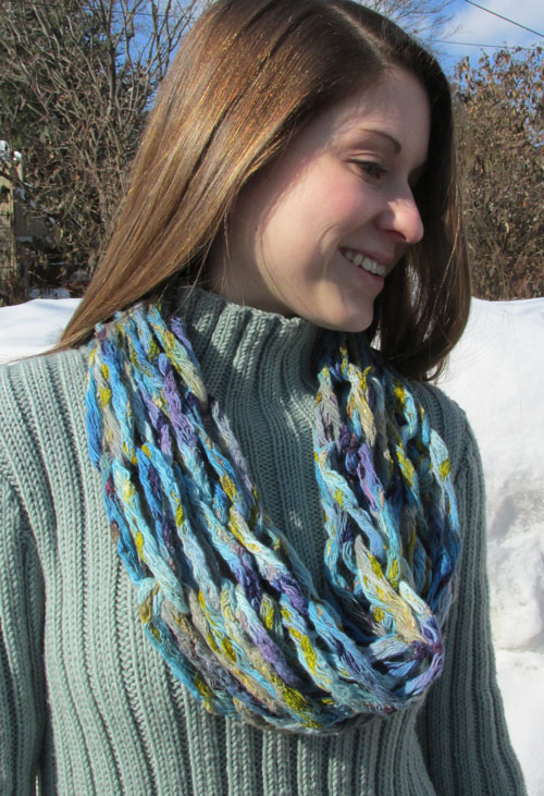 Arm Knitted Cowl in Passion Nette, courtesy of The Knitter's Edge