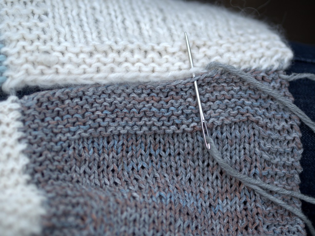 Thread your tapestry needle and stitch edge square together using whip stitch method. It's ok if you need to skip sts to produce an even finish. 